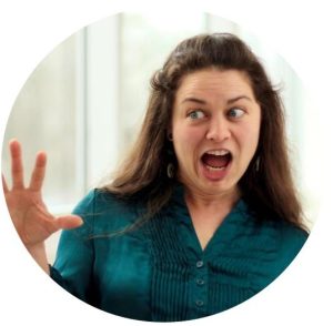 candid picture of Erin mid-explanation, with energetic facial expression and hand gestures
